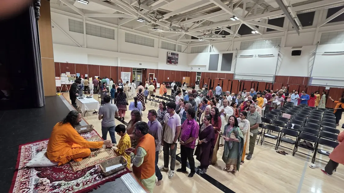 Devotees lined up for prasad from Swamiji after discourse