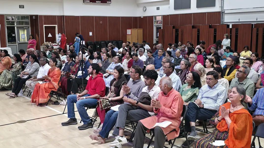 Devotees seated and engaged at Sacramento LTP