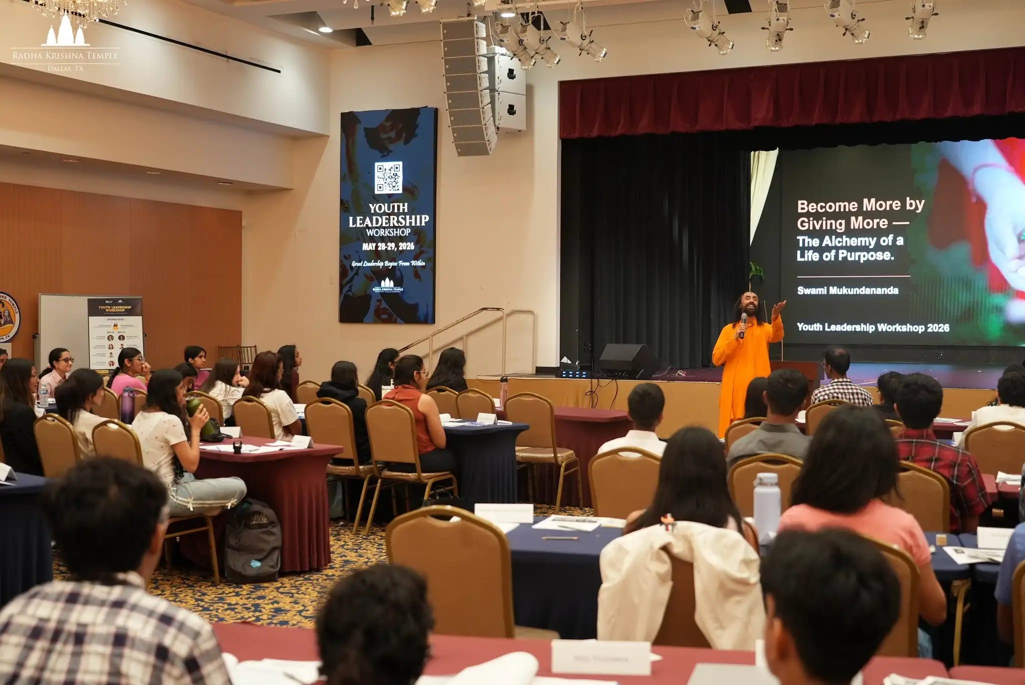 Swami Mukundananda addresses students during a Shark Tank style business challenge session at the Youth Leadership Workshop.