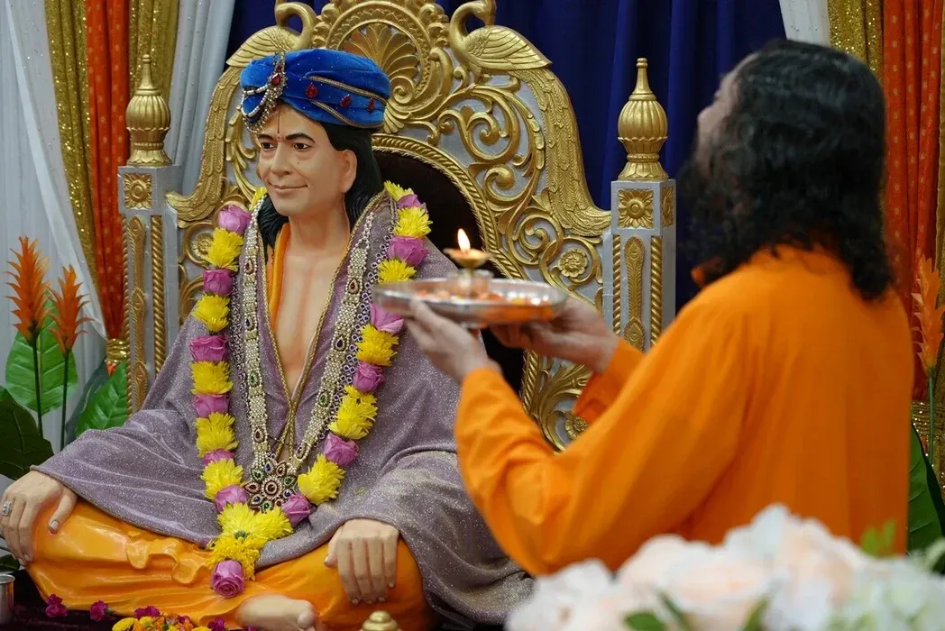 Swamiji performing a Guru Purnima arati