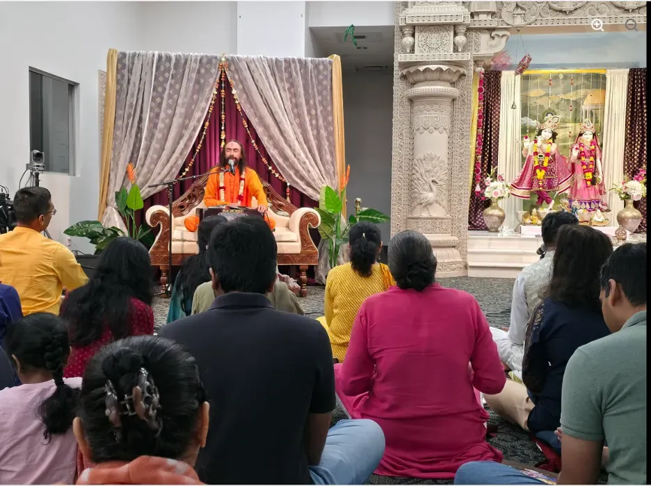 Swami Mukundananda leading devotees in kirtan 